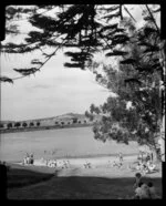 Judges Bay, Parnell, Auckland, showing people near beach and Rangitoto Island in the far distance