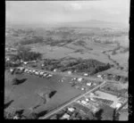 Glenfield, North Shore, Auckland, view of residential houses with roads surrounded by farmland, view to Takapuna and Lake Pupuke with Rangitoto Island beyond