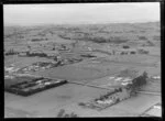 Papatoetoe, Auckland, showing motel beside Southern Motorway with views through to open farmland and the Hauraki Gulf beyond