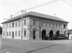 Central Fire Station, on the corner of Guyton and Wilson Streets, Wanganui, showing fire engines and firemen
