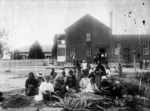 The Geyser Hotel, Whakarwarewa with a group of women in the foreground