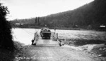 Punt on Buller River carrying cars