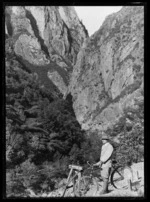 Joseph Divis wearing a safari suit with bicycle in Karangahake Gorge
