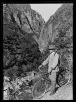 Joseph Divis with bicycle beside Waitawheta Stream