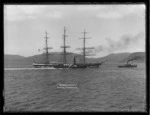 Sailing ship Invercargill being towed into Dunedin with steam tugboat pulling, and paddle steamer tugboat alongside