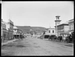 Victoria Avenue, Whanganui, looking east, including the second Post Office and clock tower, Williamson & Company chemists, and Mitchell & Richards Family Butchers