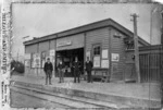 Four men in front of Upper Hutt Railway Station