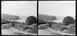 Unidentified man on road with view of ocean [Pounawea, Catlins, Clutha District, Otago Region?]