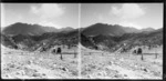 Unidentified woman and small child walking in the Remarkables, Queenstown-Lakes District, Otago Region