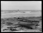 The last of the "Antioco [i.e. Antiocco] Accame", the final sinking of the ship at Katiki Beach, 1901. There is a dinghy pulled up on the beach in the foreground.