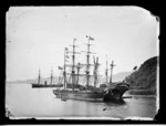 Two ships and a hulk moored in Otago Harbour; the barque "Woodville", HMS "Dido" (screw corvette, steamship), and the hulk "California".