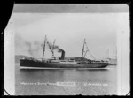 SS Waikare leaving harbour, flying bunting