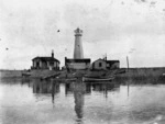 Boats, buildings and a lighthouse, at Nelson