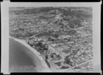 View of Browns Bay, East Coast Bays, Auckland, with an overlaid architectural drawing and label 'East Coast Bays Borough Council Civic and Cultural Centre, Browns Bay, Bruce Henderson and Wheeler, Architects, Job No.67/1, Sheet No. 1'