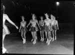 Marching girls on rollerskates, on an indoor skating rink, Lower Hutt