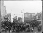 Cathedral Square, Christchurch, showing procession and archway with sign reading Waimairi