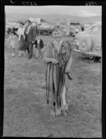 A boy whose shoulders are draped with prize ribbons, at the Wairarapa Agricultural and Pastoral Show, Carterton