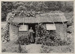Mrs Frederica Bell in the doorway of the second hut at Denham Bay, Raoul Island