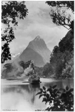 Boat travelling through Milford Sound toward Mitre Peak