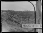 View from Houghton Bay Road of outhouses at a housing construction site on Buckley Road, Southgate, Wellington