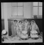 Two unidentified Indian couples cutting the cake at a wedding in Newtown, Wellington