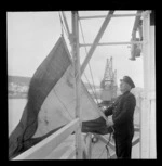 Hoisting a signal flag for the Wellington Harbour Board