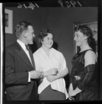 Two unidentified women and a man at a Wine and Food Society evening [Wellington?]