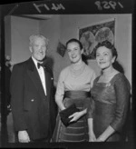 Two unidentified women and a man at a Wine and Food Society evening, [Wellington?]