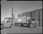 Timber being loaded onto a truck at Odlins, Petone, Wellington