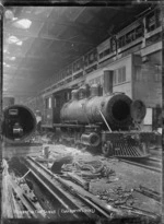 Wd class steam locomotive, NZR 323, in the erecting shop at Petone Railway Workshops.