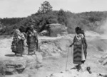 Maori women cooking food in hot springs
