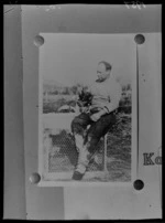 West Coast farmer and mass-murderer Stanley Graham, sitting on a chicken coop