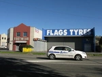 Flags_Tyres_Garlands_Road,_Woolston_Christchurch_March_2009.JPG