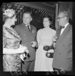 Group of unidentified guests at cocktail party, at UK High Commissioner's home  for visiting airmen (Blue Domino)