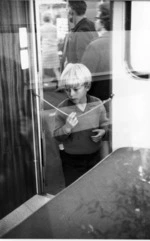 Boy at glass door, string 1970.tif