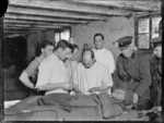 Members of the 2nd NZ Field Ambulance, injecting gum infusion into a patient