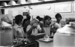 Cafeteria, Lady reaching for straw 1971.tif