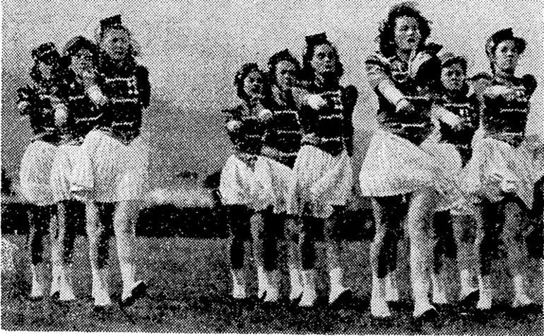 Image: The "Minster" team, winners of the Hutt Valley Inter-house Girls' Association's marching championship, held at the Petone Recreation Ground on Saturday afternoon. They won both the marching and the march past events. The day was very tvindy, and the girls found difficulty in keeping their hats on. (Evening Post, 26 March 1945)