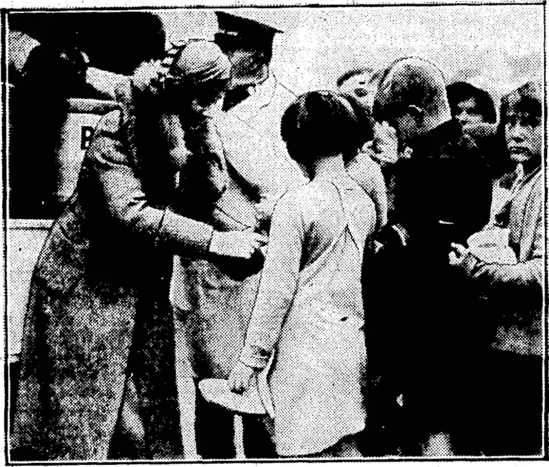 Image: Evening Post" Photo. HER EXCELLENCY DISPENSES HOSPITALITY.—Lady Bledisloe assisting with the distribution of soup and bread yesterday when their Excellencies visited the Salvation Army's travelling soup kitchen at Auckland. (Evening Post, 23 June 1933)