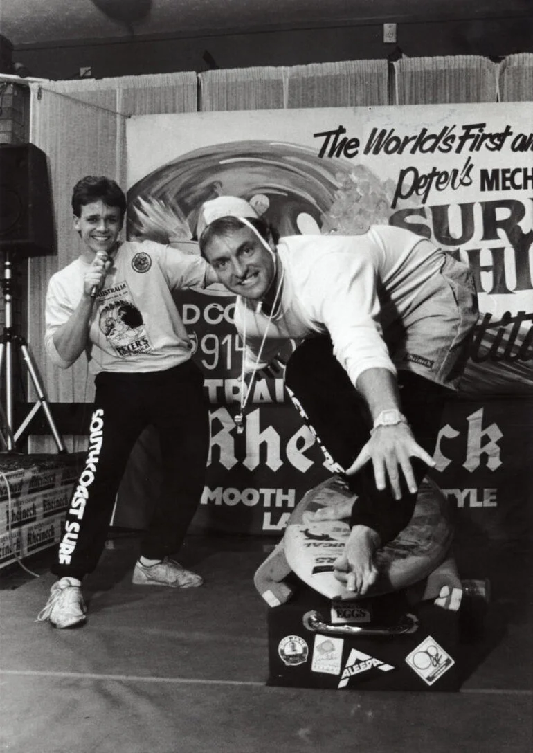 Image: Indoor surfing; mechanical surfboard inventor Peter Konrad and his manager Mark Burton-Brown.
