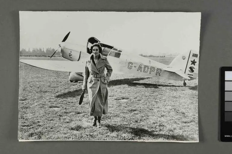 Image: Jean Batten in front of Percival Gull G-ADPR at Hatfield Aerodrome, England
