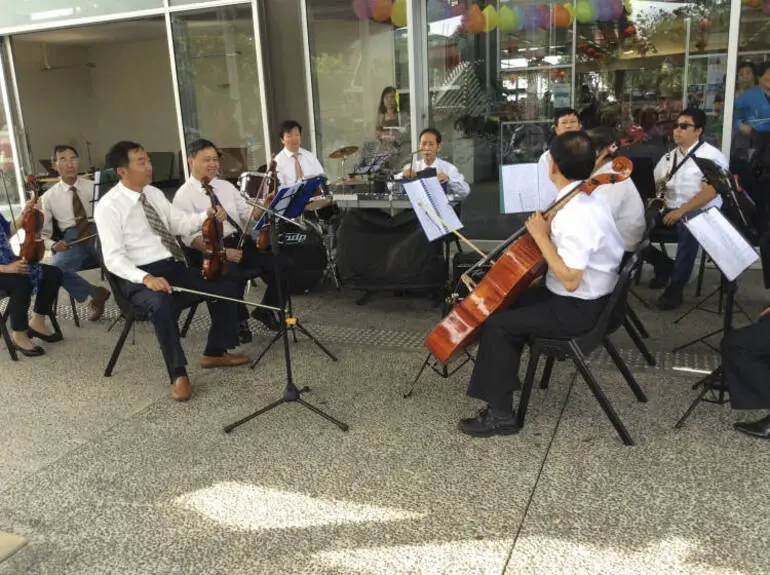 Image: Onehunga Chinese Association members performing outside Onehunga Library.