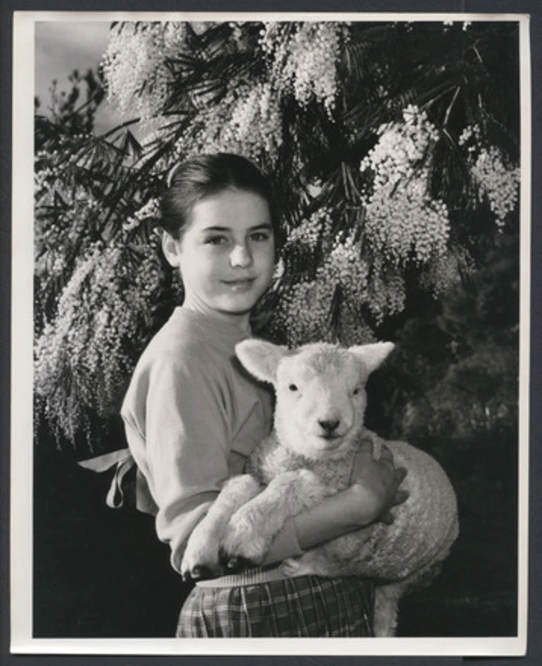 Image: [Girl holding pet lamb]