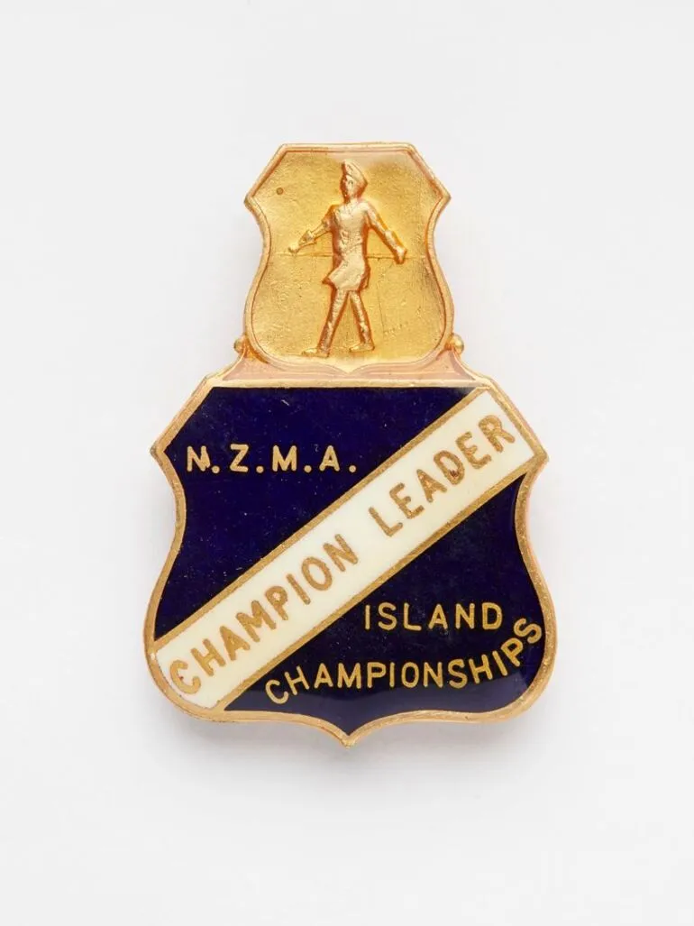 Image: New Zealand Marching Association Island Championships badge: Champion Leader