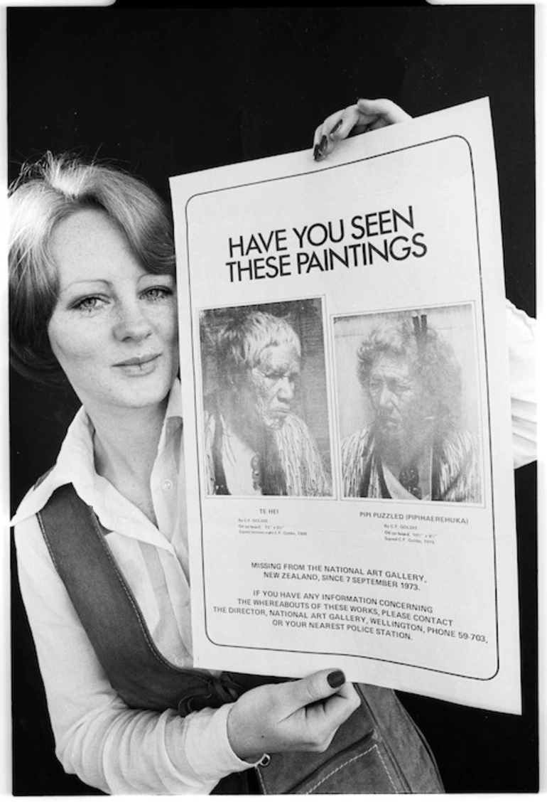 Image: Catherine Perry holding poster depicting lost paintings by Goldie