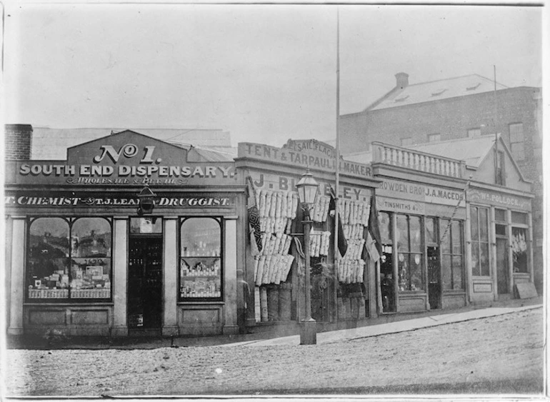 Image: Creator unknown :Photograph of businesses on Walker and Princes Streets, Dunedin