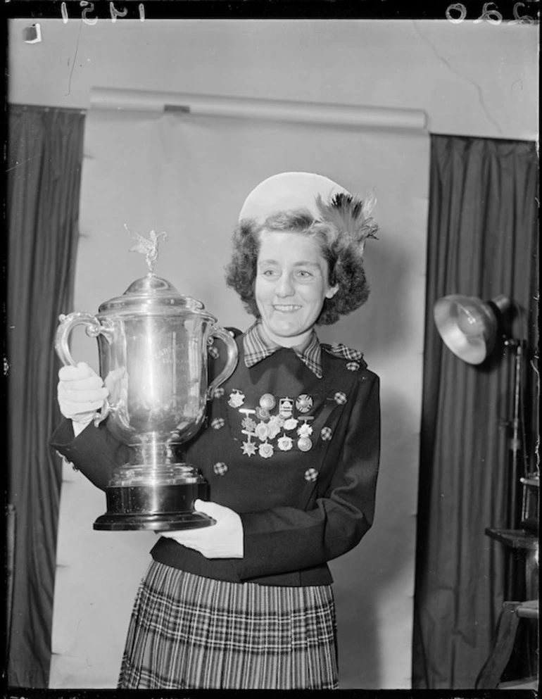 Image: Miss Flo McLeod with a cup for marching