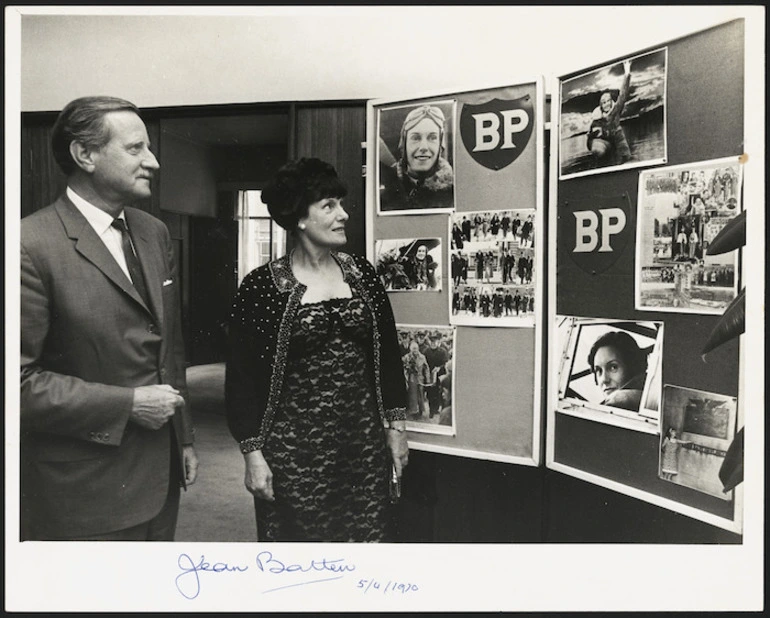Image: Aviator Jean Batten alongside a display of photographs - Photograph taken by Photo News