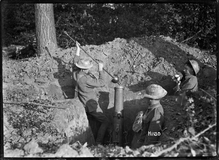 Image: Three New Zealand soldiers using a trench mortar in Le Quesnoy, France, during World War I
