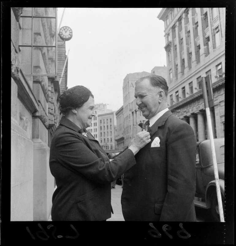 Image: Mrs S Holland selling a poppy to Prime Minister, Mr Sidney George Holland, Wellington [for Anzac Day]